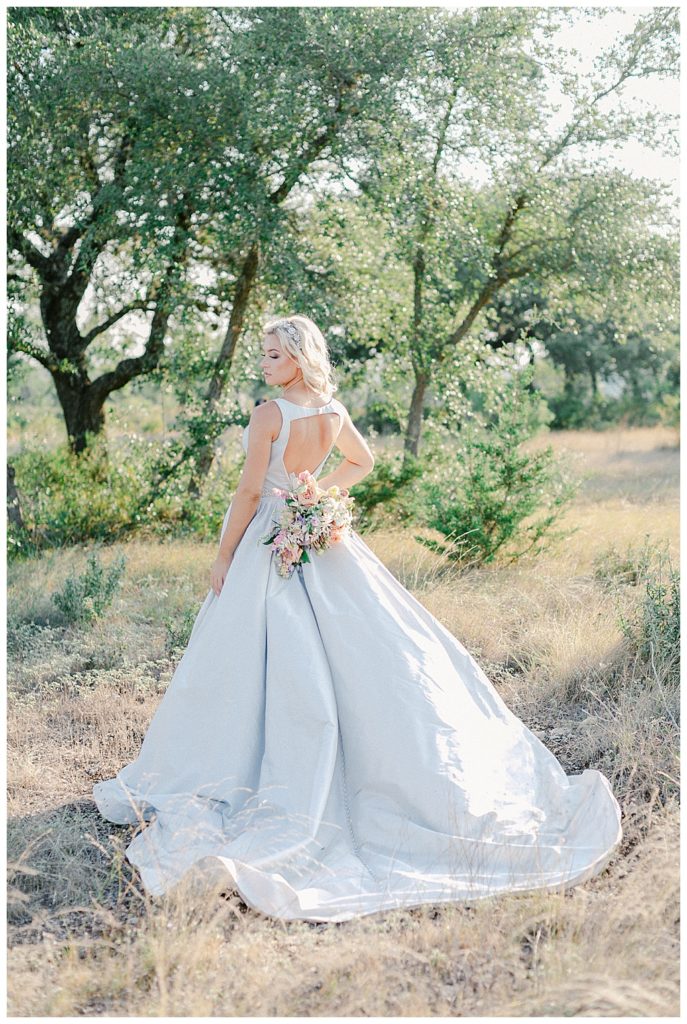 texas bride holding bouquet behind her back