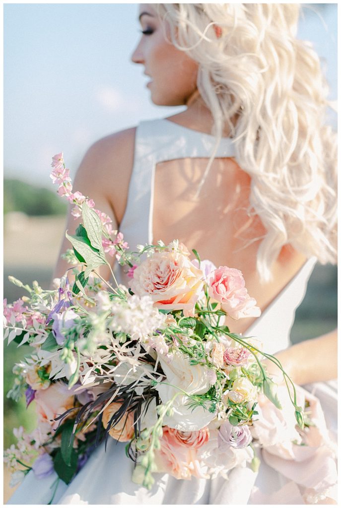 san antonio bride holding bouquet behind her back