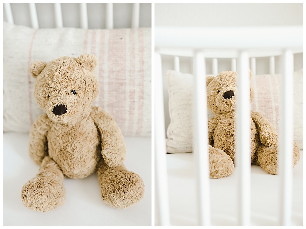 Brown teddy bear in a crib
