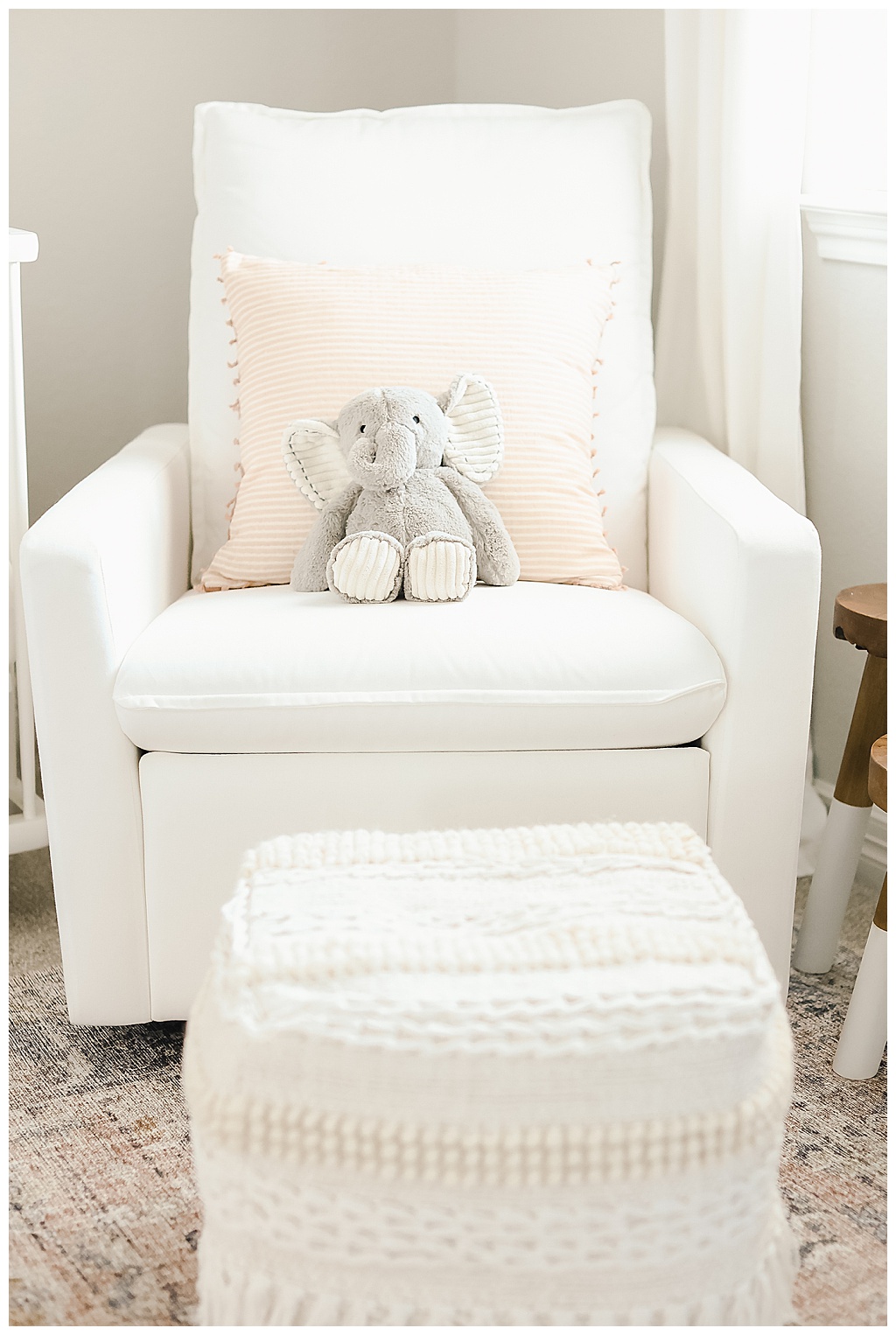 stuffed elephant on a white chair