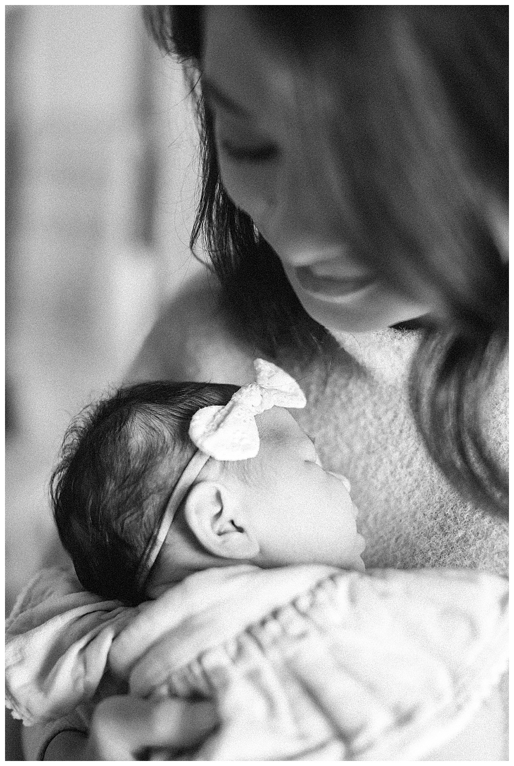 Mother embracing her newborn baby