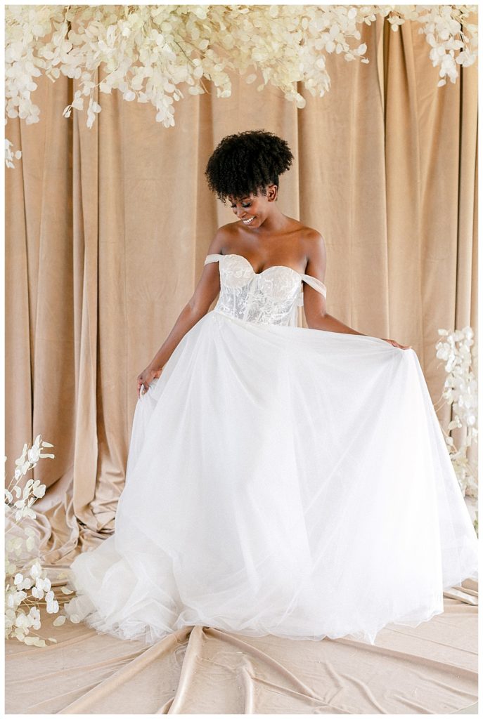 Bride showing off her bridal gown