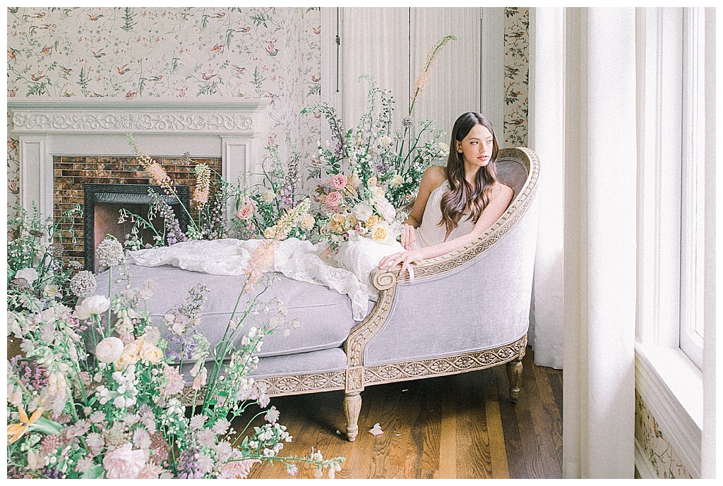 Bride surrounded with spring floral arrangements