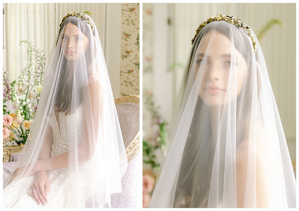 Bride wearing a golden grown and cathedral veil.