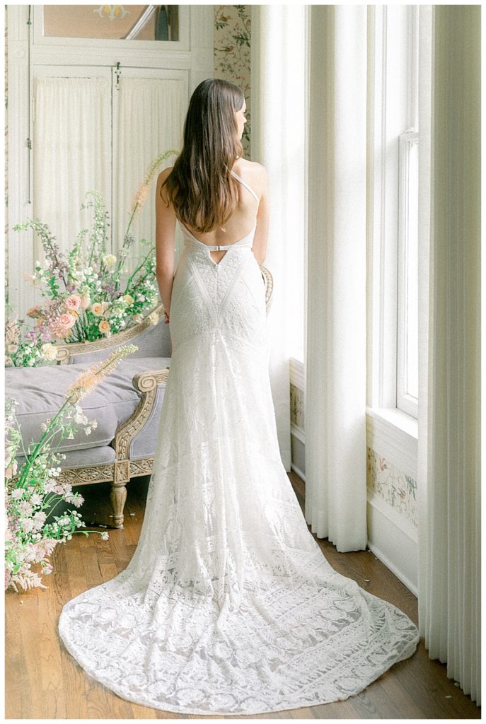 Bride revealing wedding gown back details