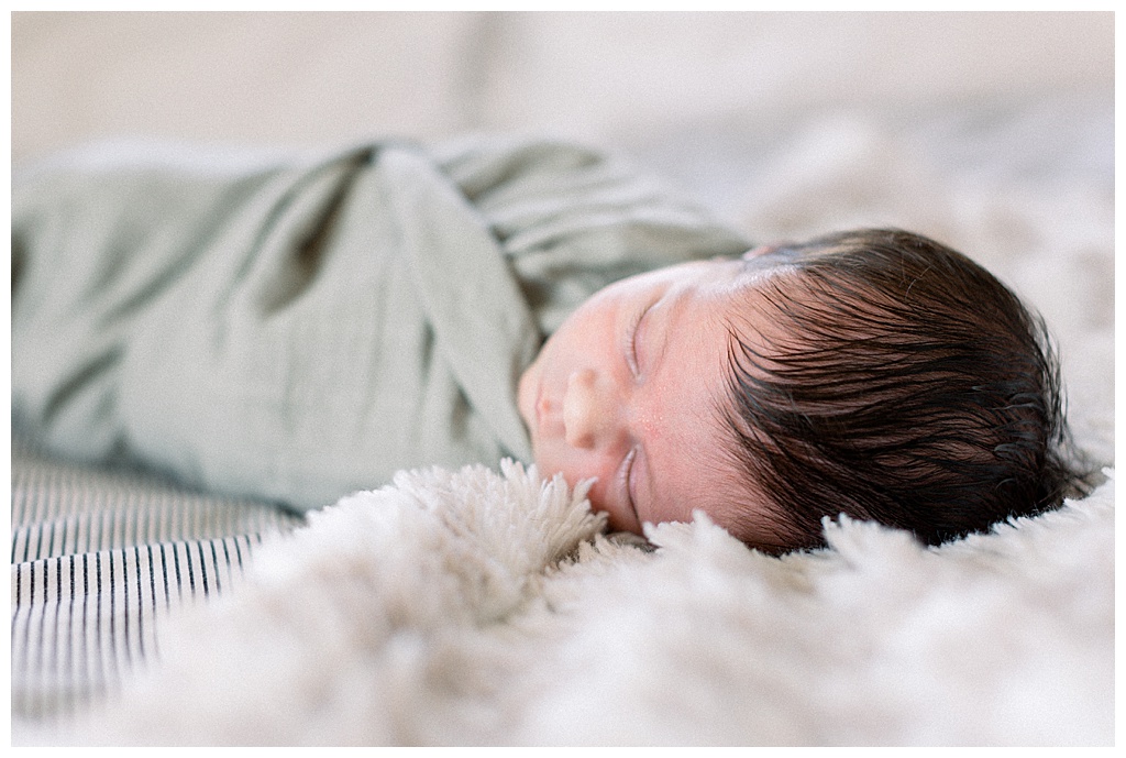 newborn baby swaddled and sleeping at-home lifestyle newborn session