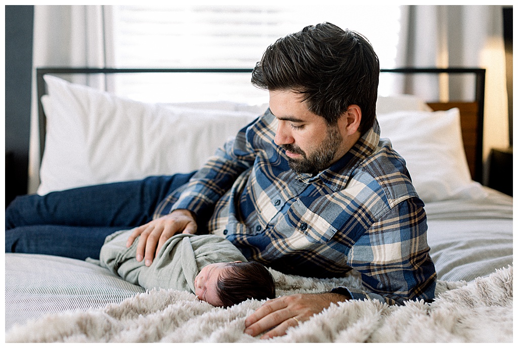 dad with newborn baby at lifestyle home newborn session