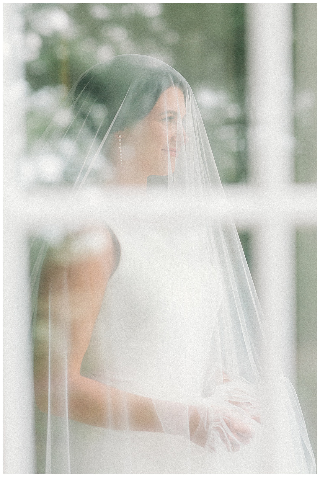 bride portrait shot through a window