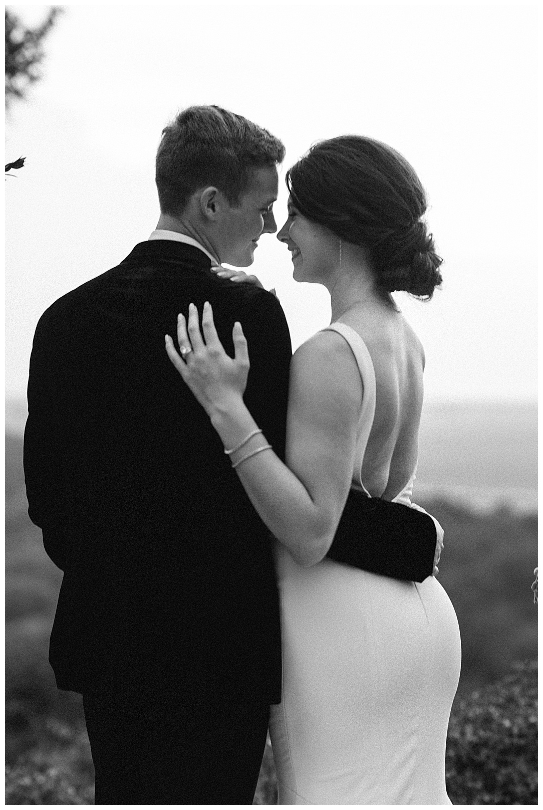 romantic black and white photo of wedding couple from behind