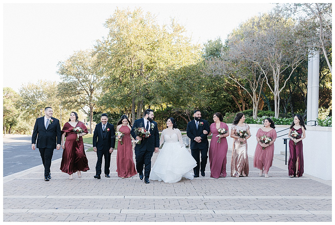 large wedding party with maroon and black