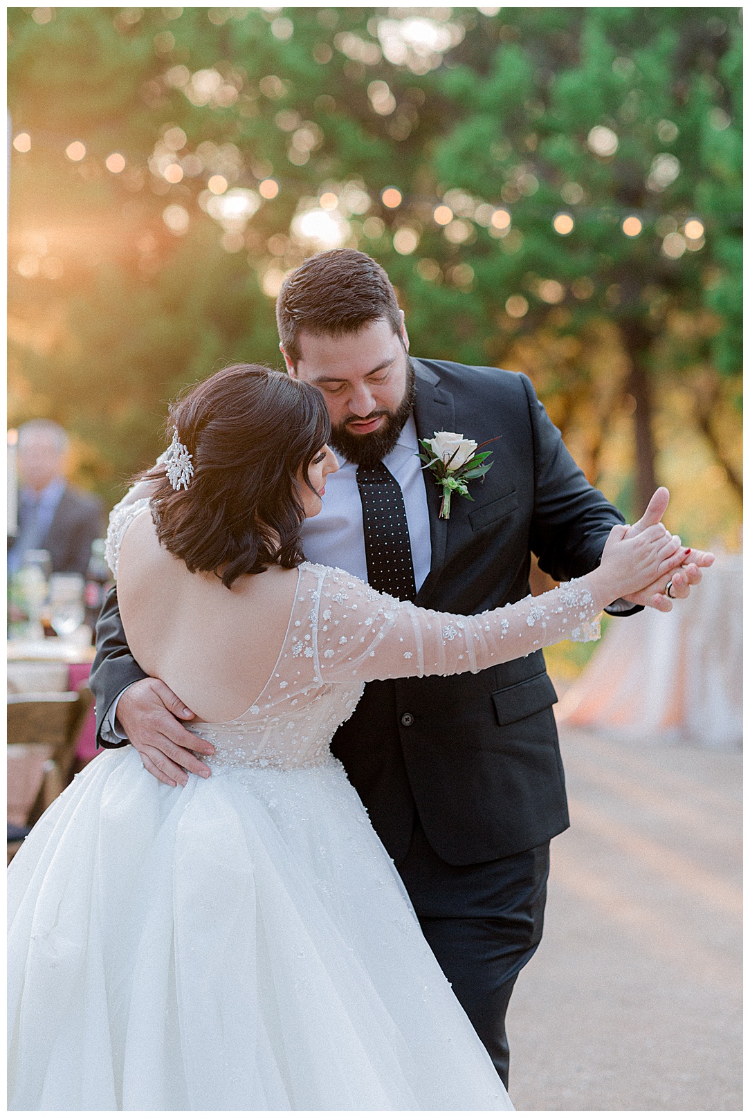 bride and groom dancing at outdoor reception