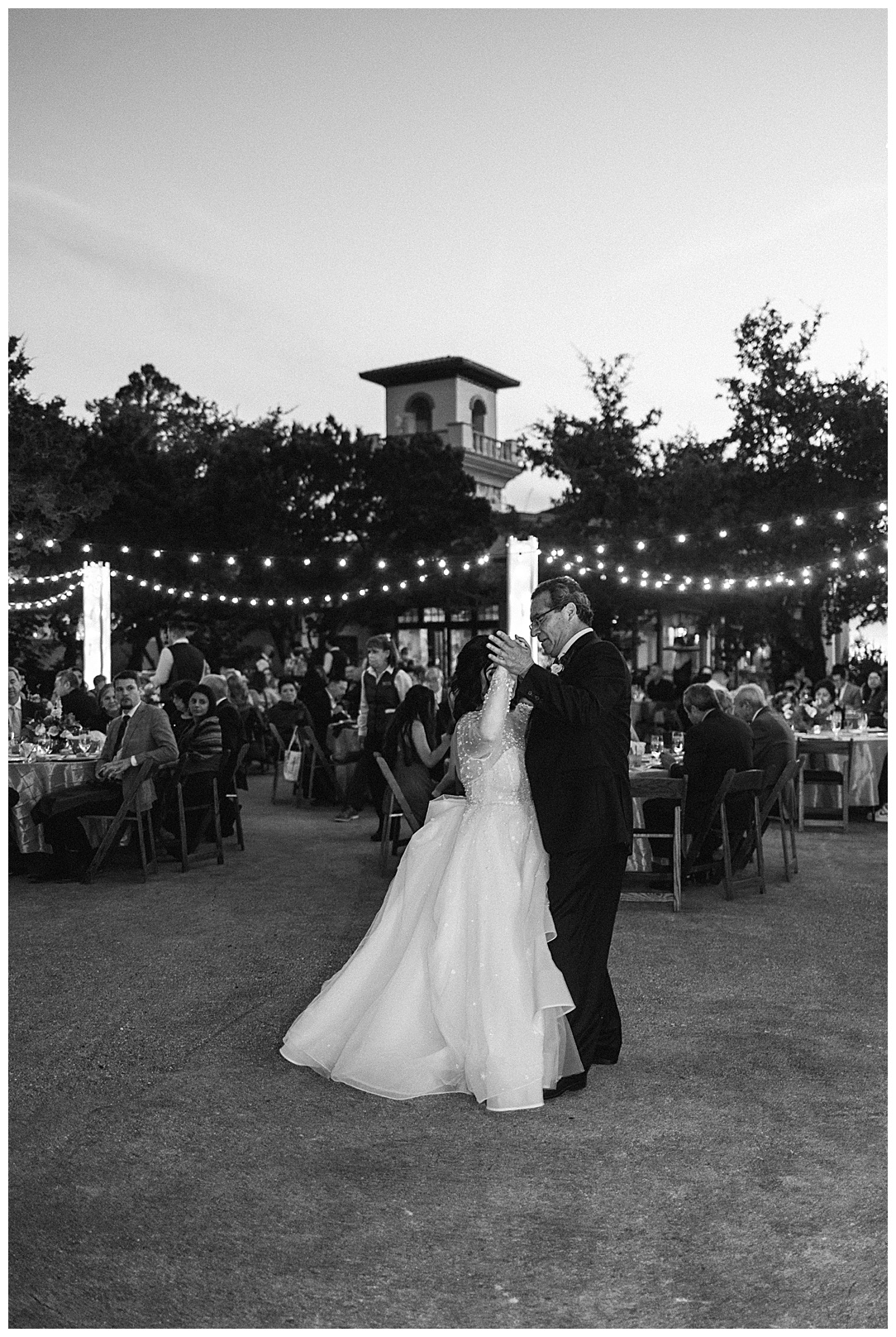 bride and groom dancing at outdoor reception