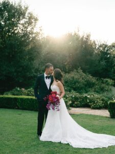 A bride and groom kissing after their ceremony for their Commodore Perry Estate wedding. 