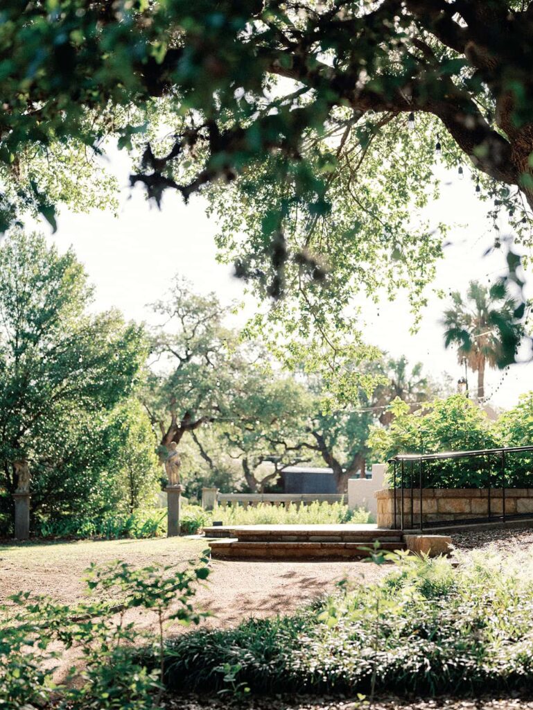 A pathway surrounded by greenery and trees at the Laguna Gloria.