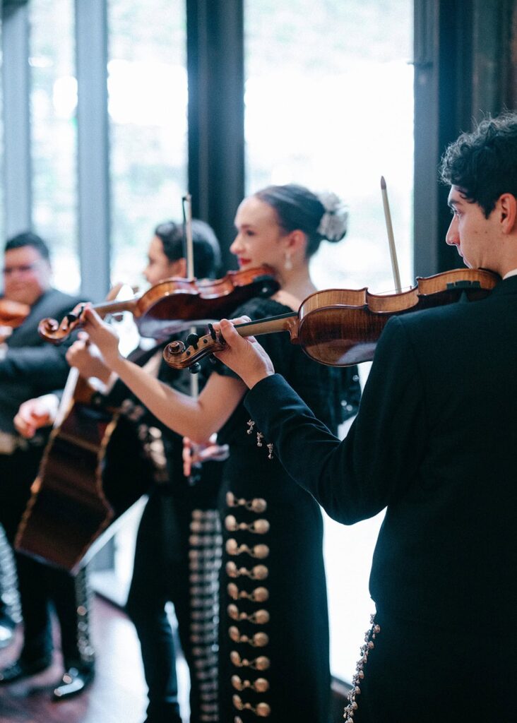 A mariachi band plays at the reception of a South Congress Hotel wedding.