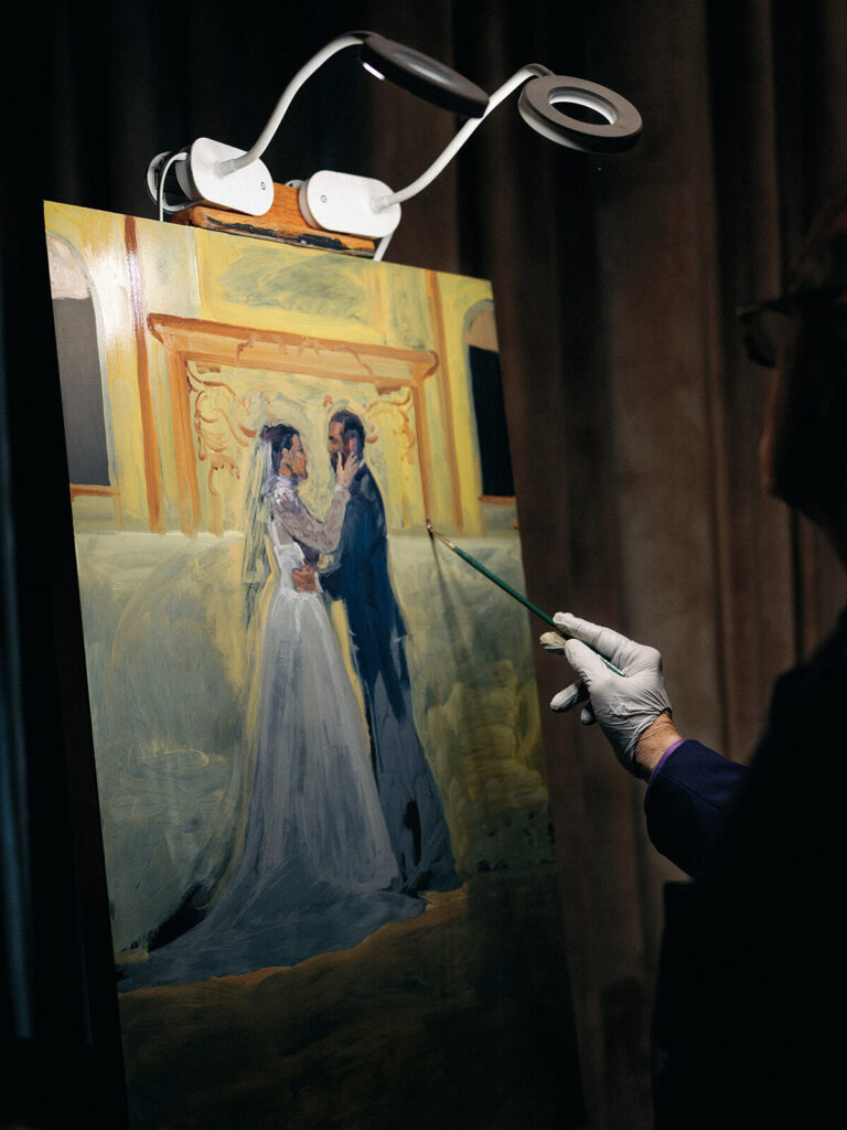 An artist paints the scene of the wedding ceremony for a Witte Museum wedding.