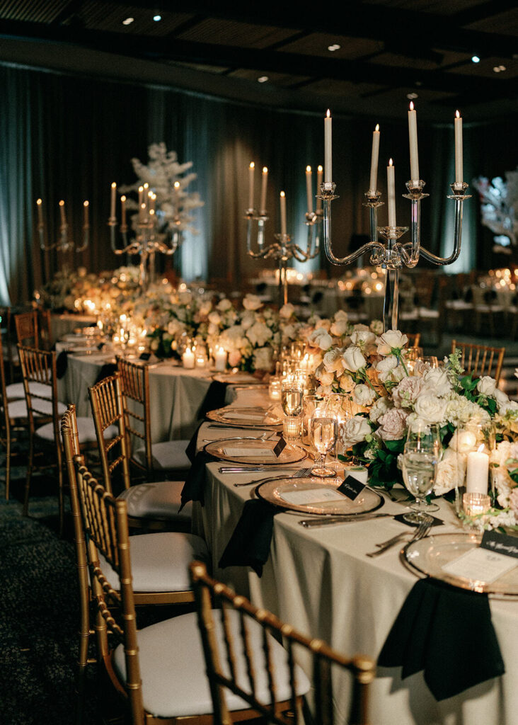 The table settings with gold chairs and tall candelabras at a Wittle Museum wedding.