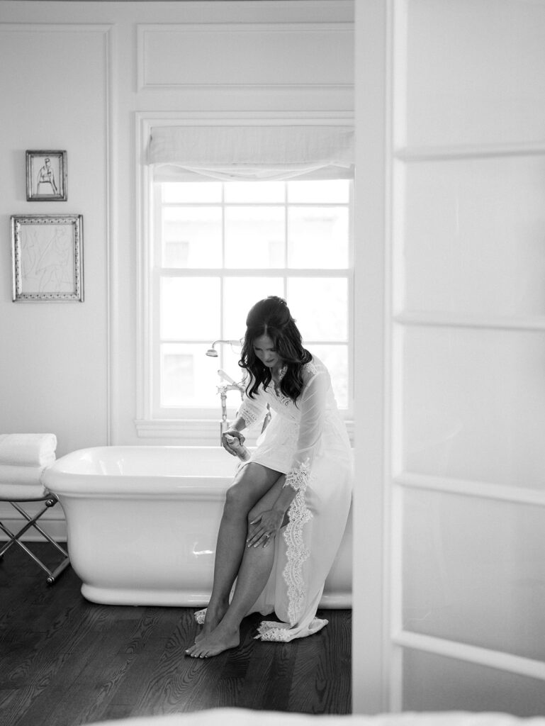 A bride calmly gets ready for her wedding, showing the importance of a well planned photography timeline for weddings.